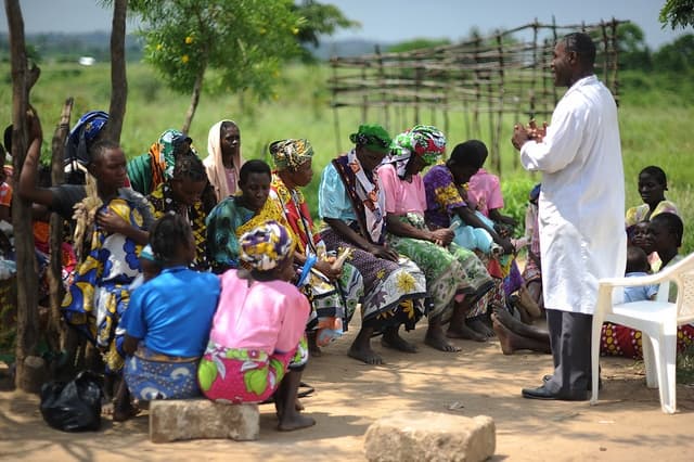 Obiumunna Na Umuada team members working with community